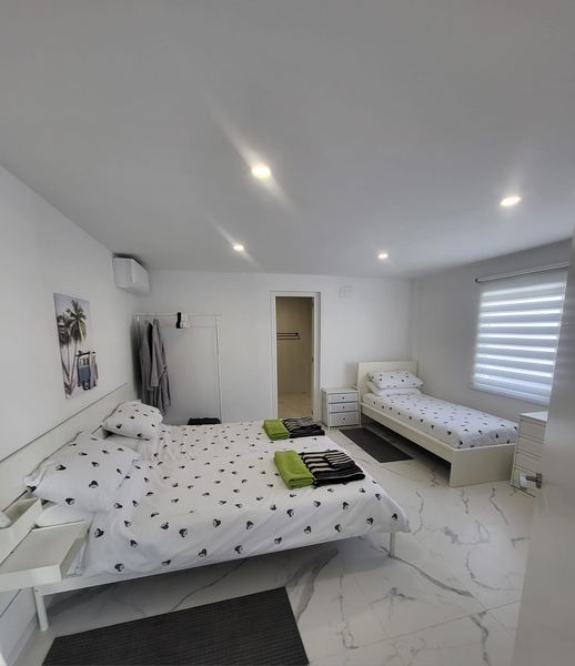 Bedroom with a double bed and a single bed