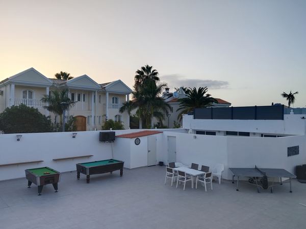 Games terrace with two pool tables, table tennis and a dartboard
